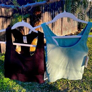 Black and green work out tank tops.